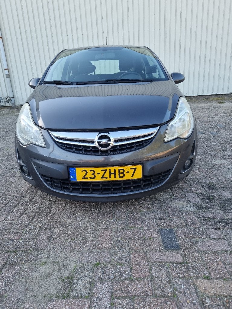 Opel Corsa 1.2 16V LPG 3D 2012 Grijs, Auto's, Voorwielaandrijving, 83 pk, Elektrische ramen, Origineel Nederlands