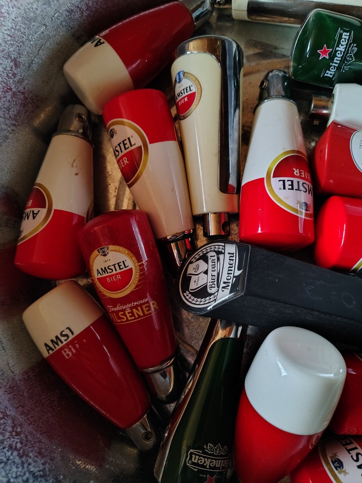 Gebruikte Amstel Tapknoppen/hendels 20 Stuks, Ophalen of Verzenden, Gebruikt, Amstel
