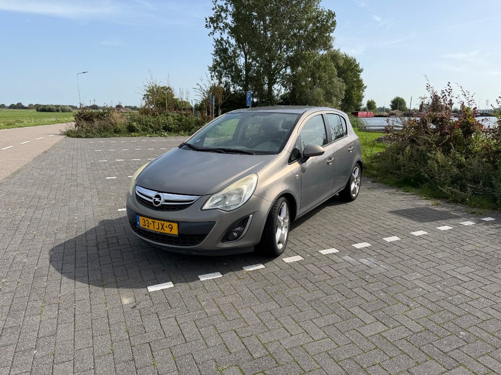Opel Corsa 1.4 16V 5D 2012 Bruin Airco Cruise, Auto's, Voorwielaandrijving, 1063 kg, 1398 cc, 4 cilinders