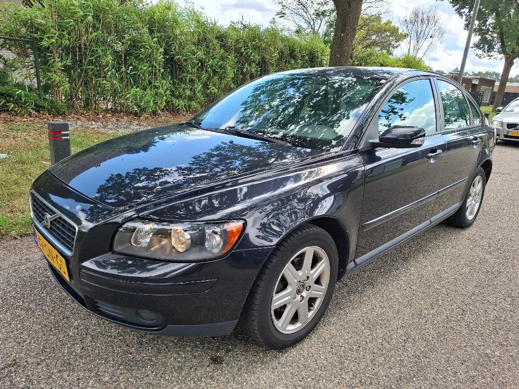 Volvo S40 1.8 2006 Zwart | Navigatie | Trekhaak | Climate, Auto's, Volvo, Voorwielaandrijving, 125 pk, Zwart, Zwart