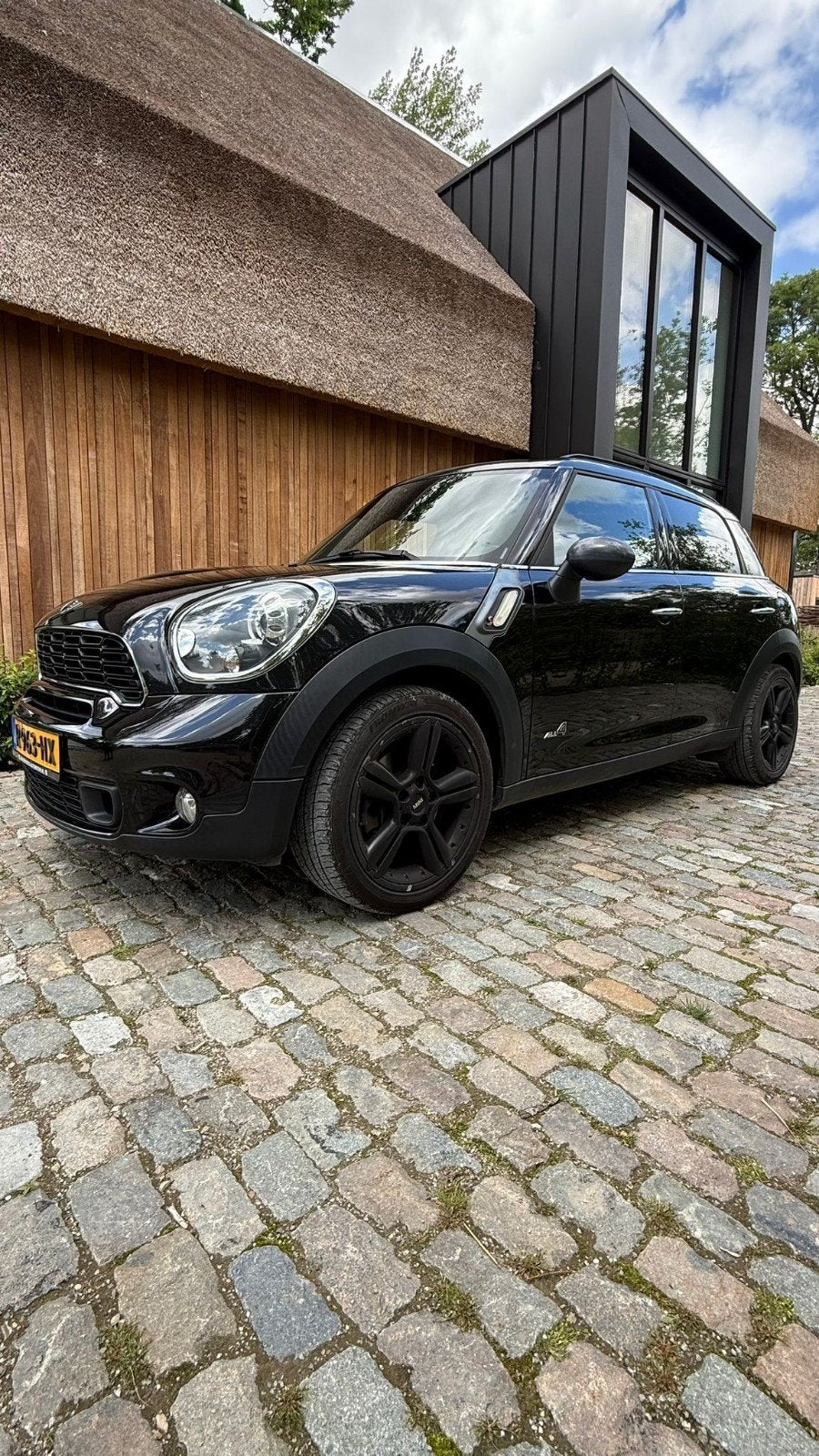 Mini Countryman 1.6 Cooper S All4 AUT 2012 Zwart, Auto's, Mini, 1380 kg, 4 stoelen, Zwart, Leder