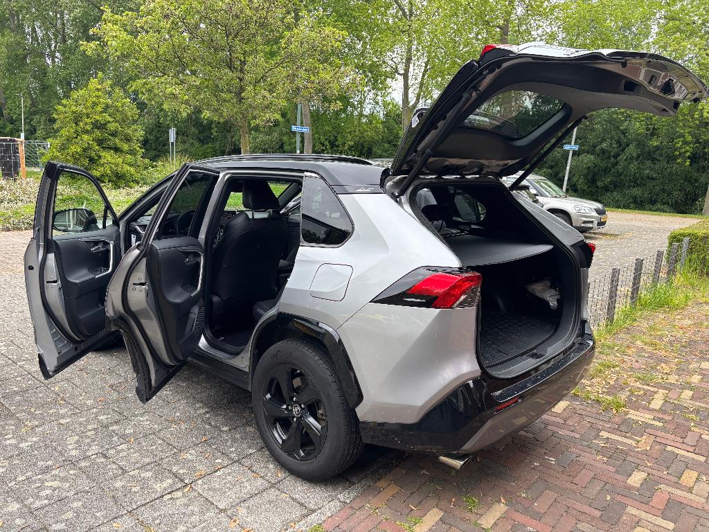 Toyota Rav4 2.5 Hybrid 222pk CVT AWD 2019 Grijs, Auto's, Toyota, Zwart, 4 cilinders, 2487 cc, Leder en Stof