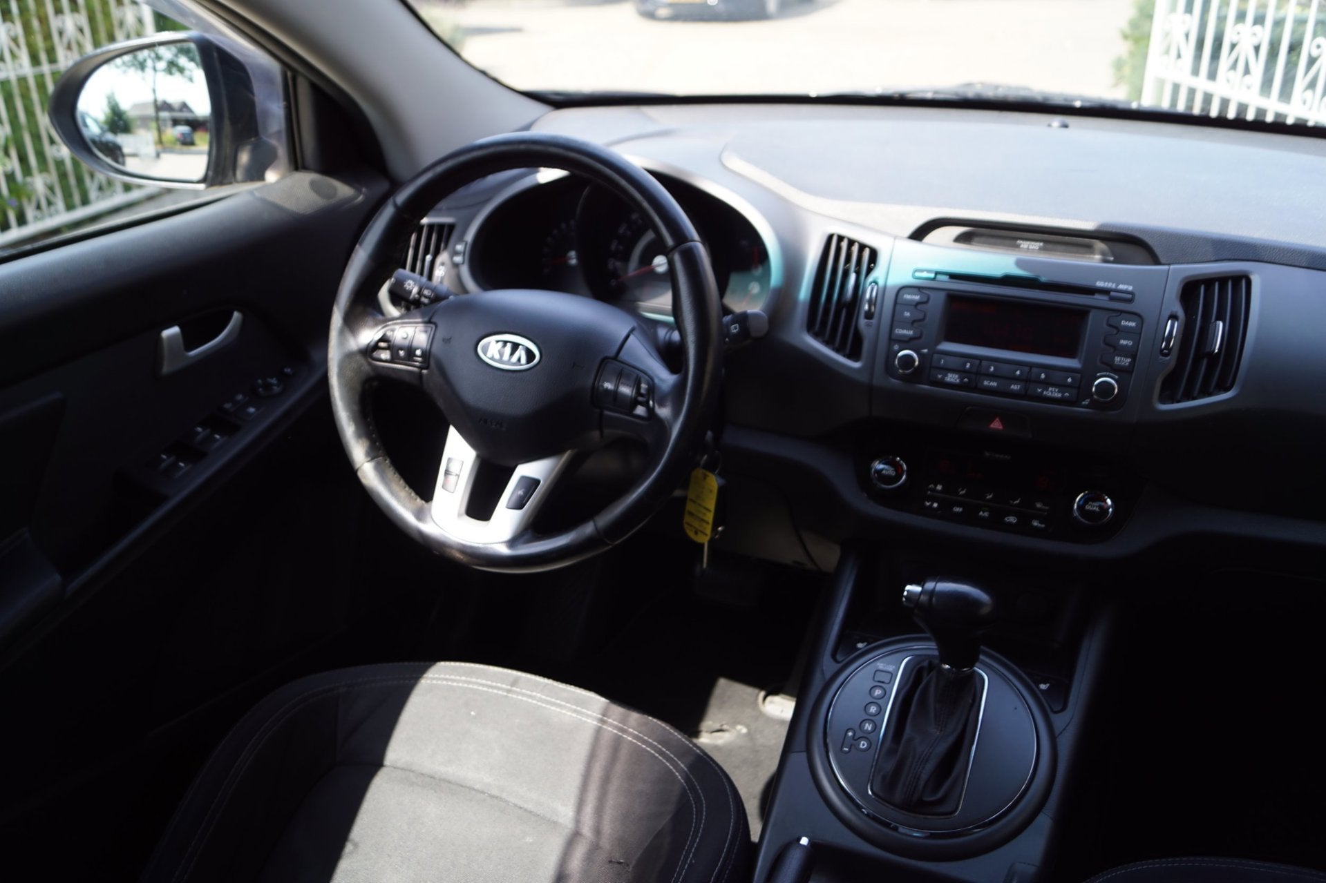 Kia Sportage 2.0 Plus Pack AWD Autom Sportst Stoelverw A Ban, Auto's, Kia, Automaat, Stof, Gebruikt, Zwart