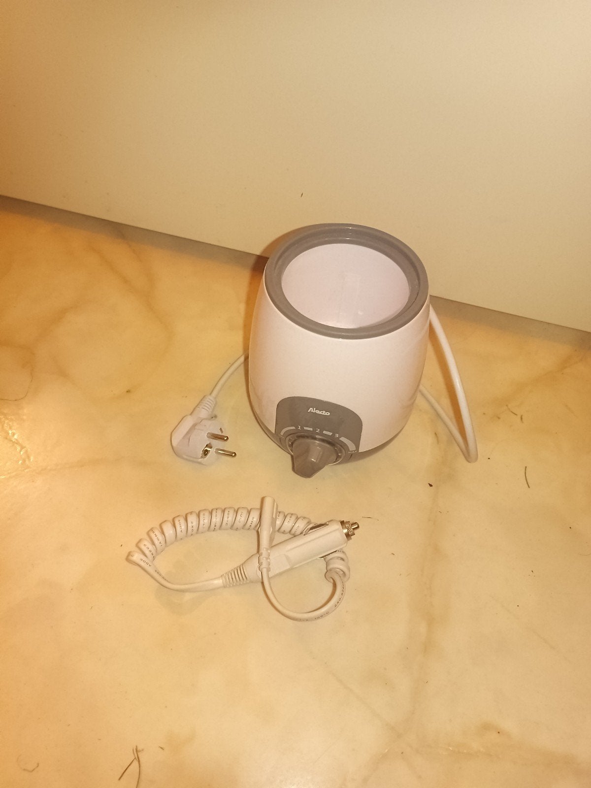 Alecto flessenwarmer met auto-adapter, Ophalen