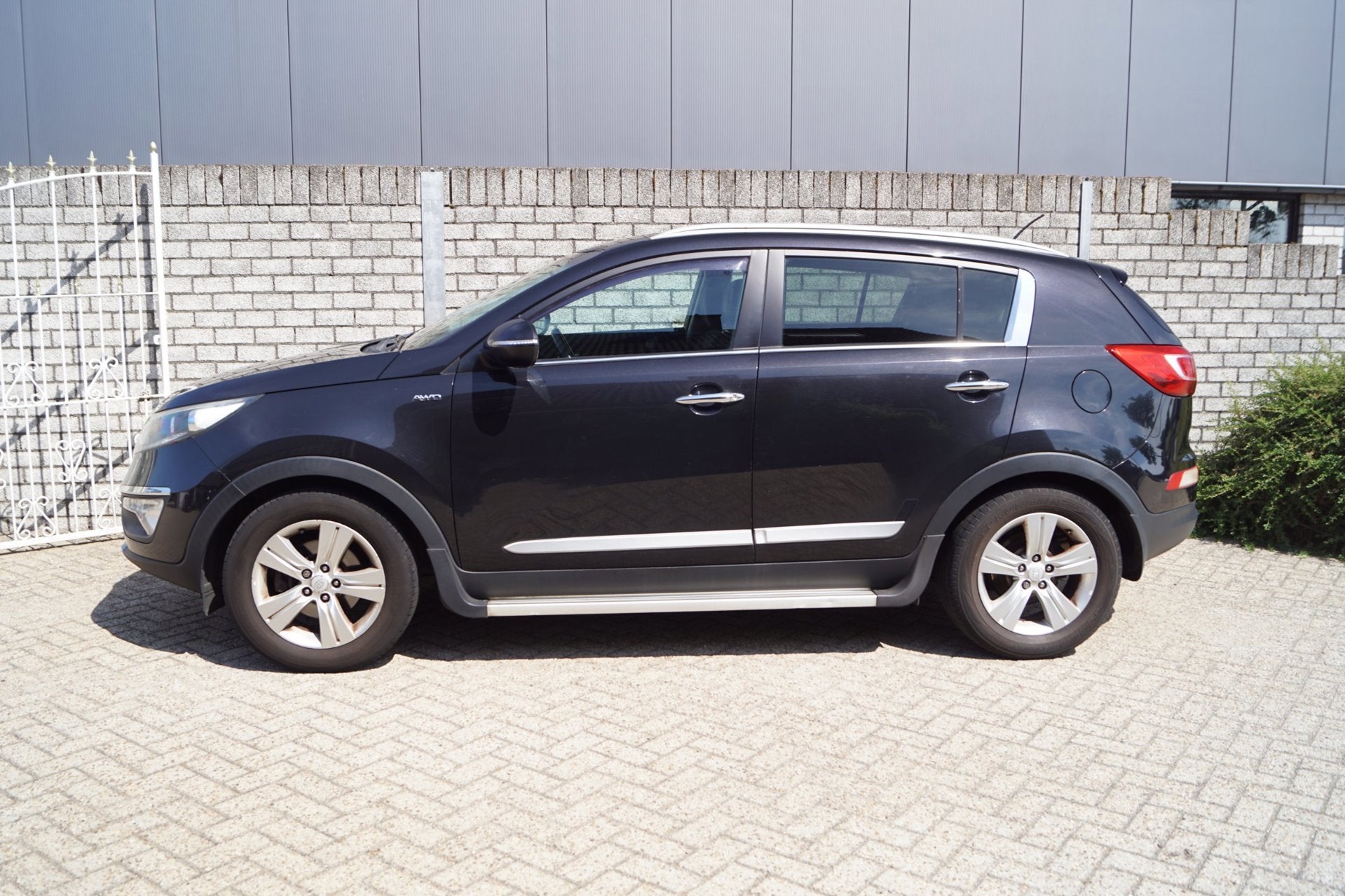 Kia Sportage 2.0 Plus Pack AWD Autom Sportst Stoelverw A Ban, Auto's, Kia, Automaat, Stof, Gebruikt, Zwart