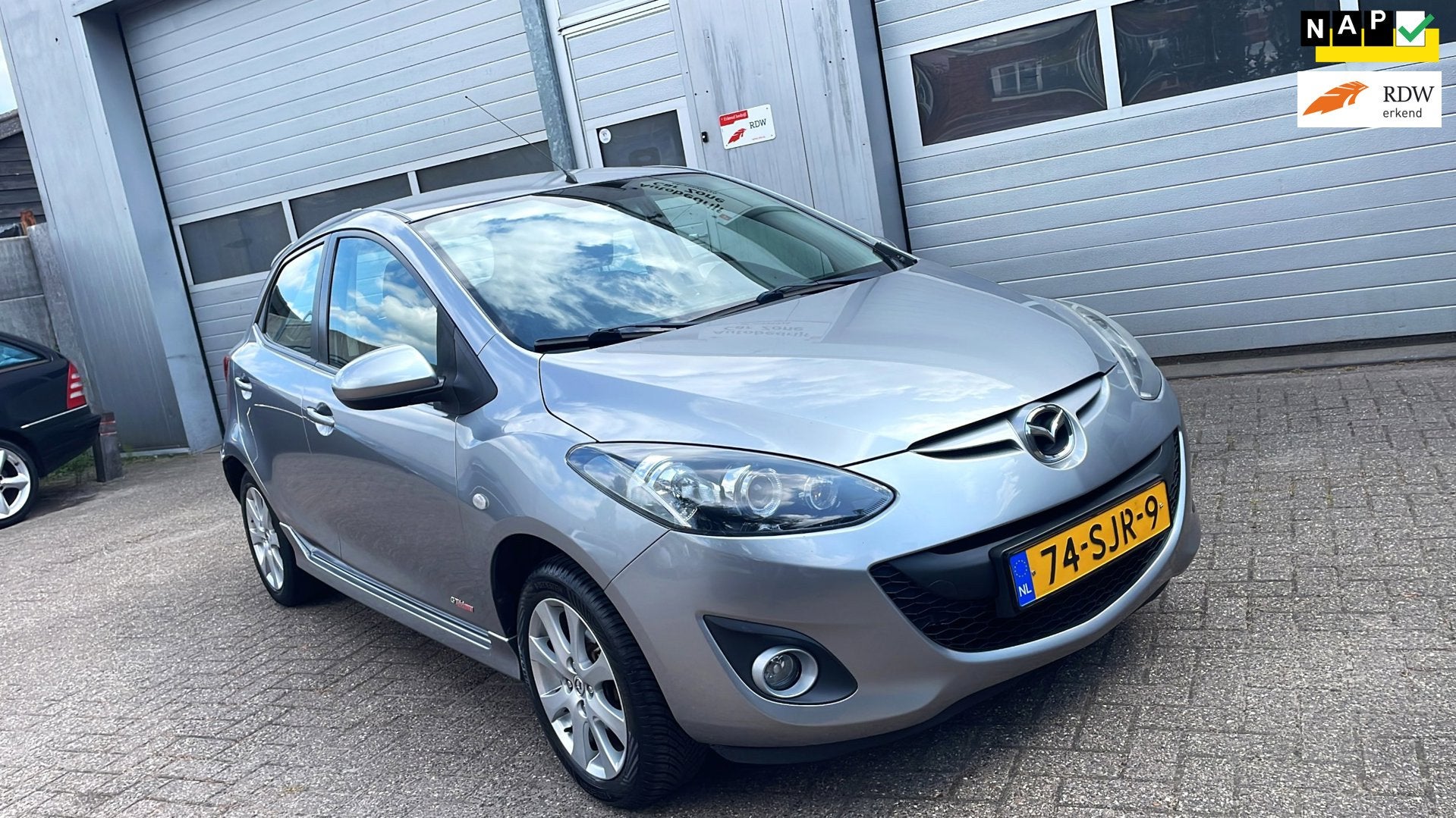 Mazda 2 1.3 BIFUEL GT-M Line LPG (G3)-Clima-Trekhaak-New APK, Auto's, Mazda, Euro 5, Stof, Zwart, 4 cilinders