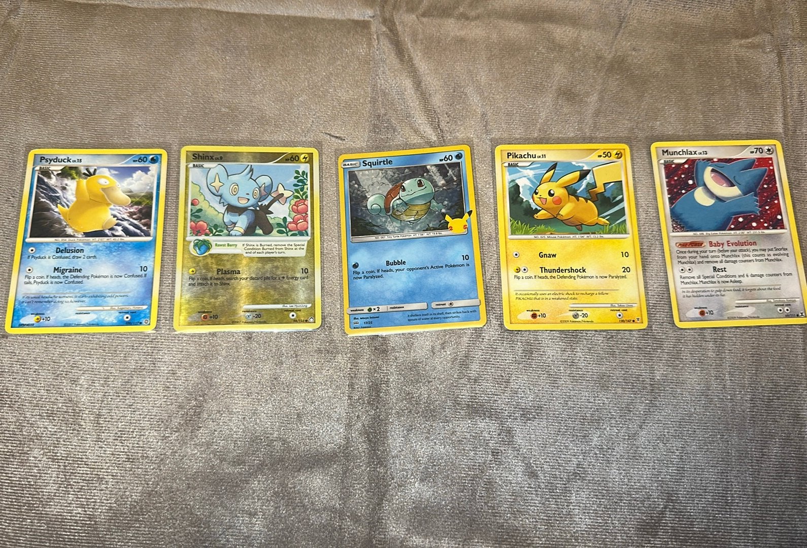 Pokémon kaarten Pikachu, munchlax, psyduck, squirtle, shinx, Ophalen, Zo goed als nieuw, Meerdere kaarten