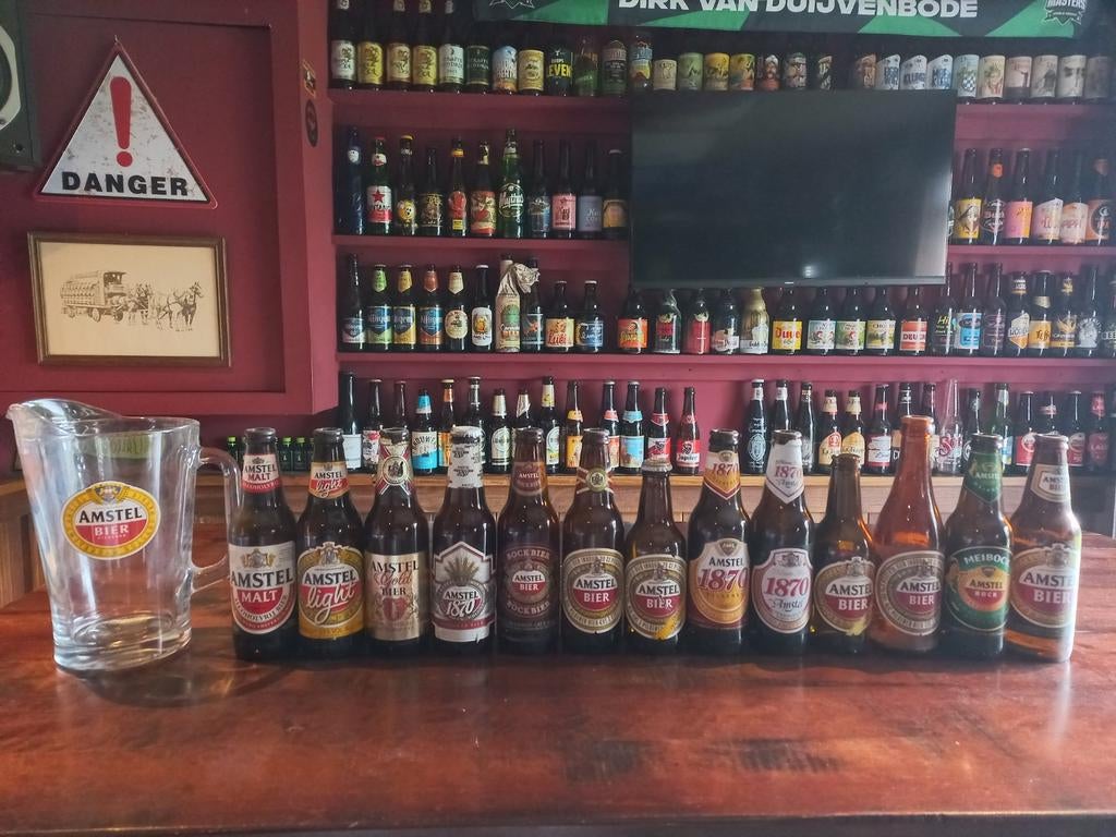Oude Amstel bierflesjes en een Amstel bierkan, Verzamelen, Biermerken, Ophalen, Gebruikt, Amstel
