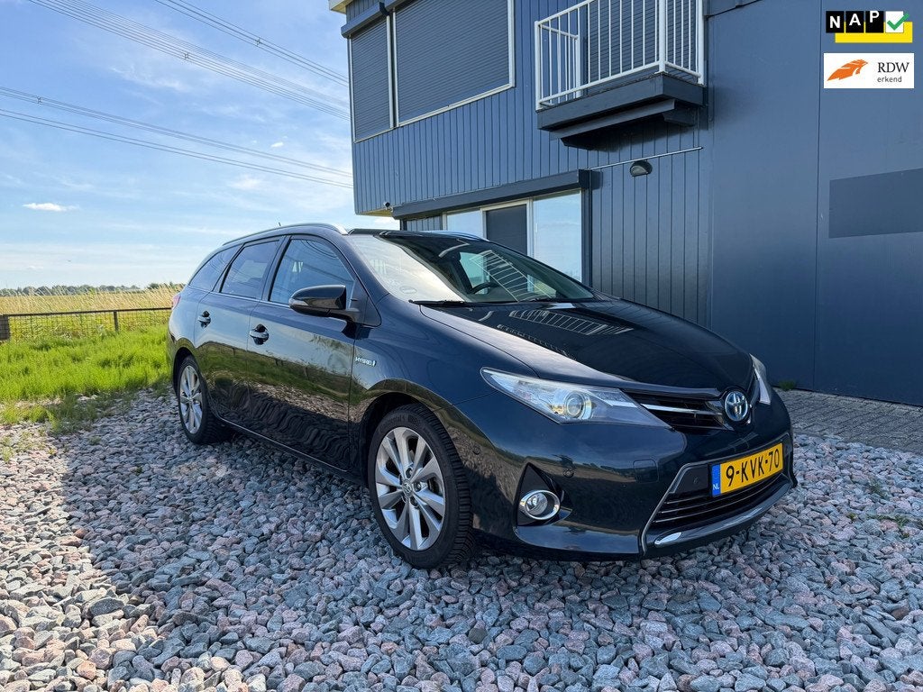 Toyota Auris Touring Sports 1.8 Hybrid Executive, Auto's, Toyota, Euro 5, Gebruikt, Automatische klimaatregeling, Leder en Stof