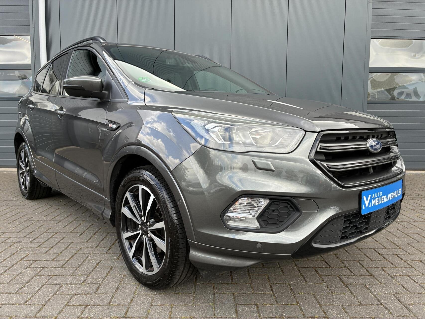 Ford Kuga 1.5 EcoBoost 150 PK ST-Line X | HALF-LEDER | NAVI, Auto's, Zwart, 4 cilinders, Leder en Stof, Bedrijf