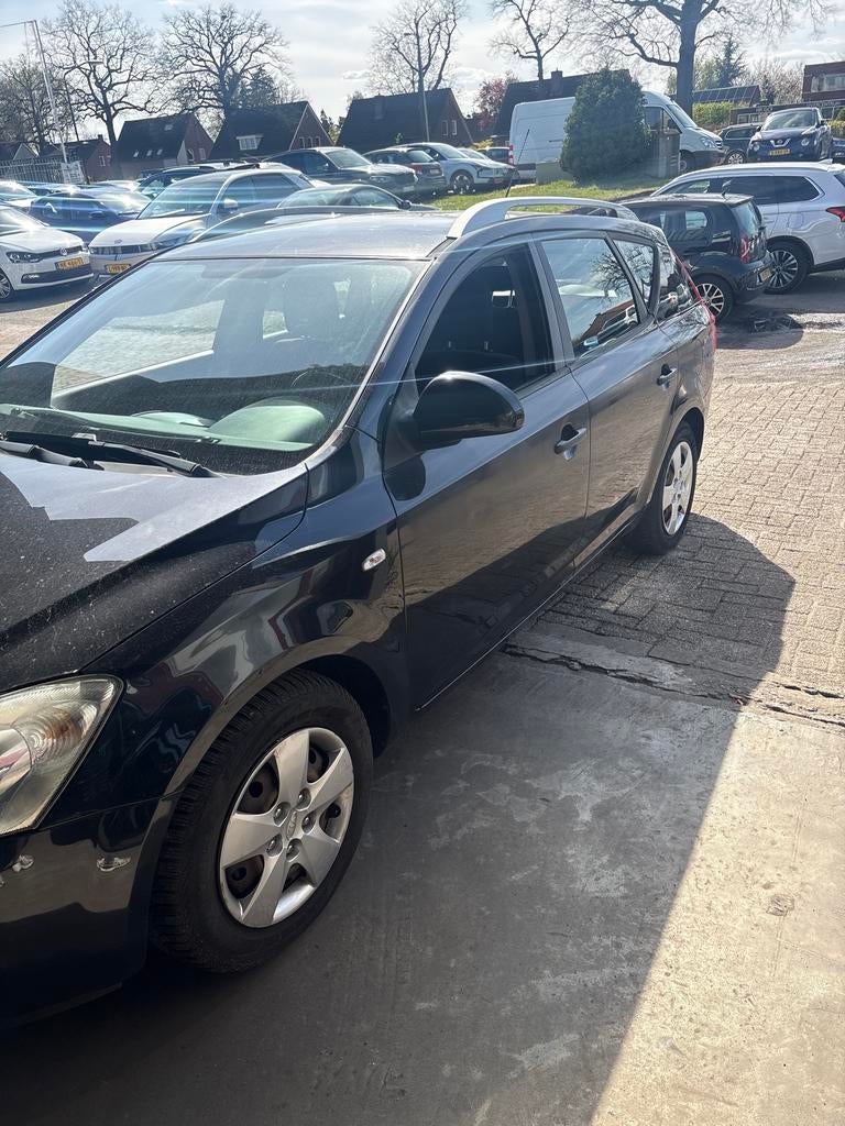 Kia (Pro) Cee d 1.4 Sporty Wagon 2009 Zwart, Auto's, Voorwielaandrijving, 4 cilinders, 1396 cc, Zwart