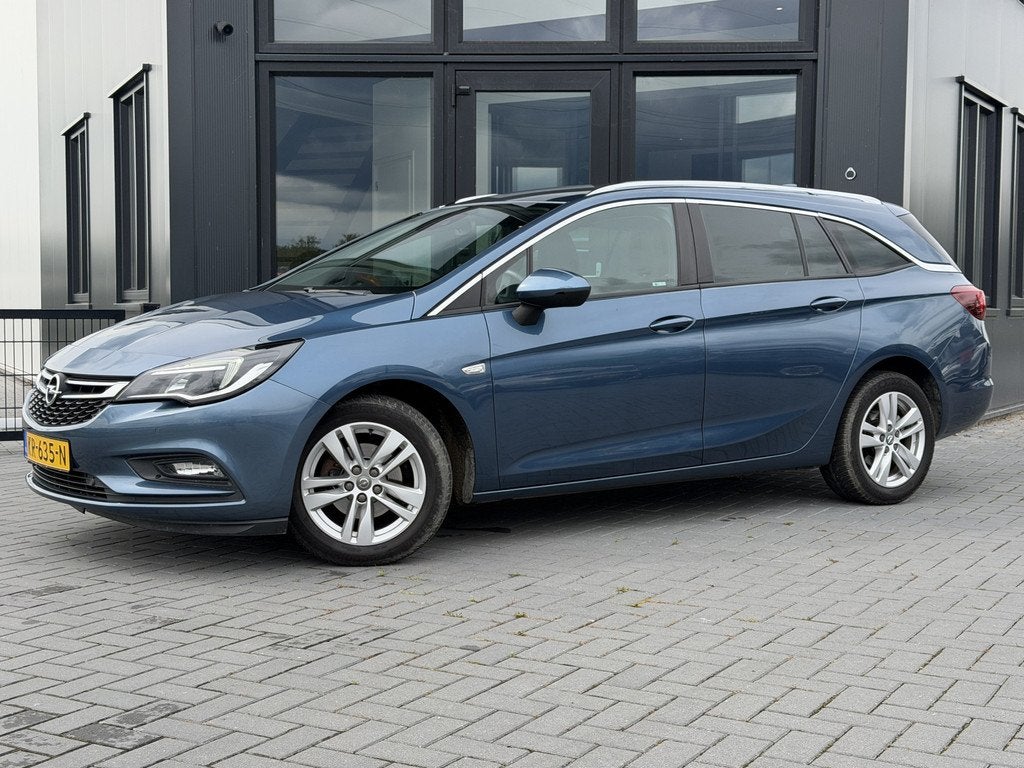 Opel Astra Sports Tourer 1.0 Bns+ Sportstoel | Climate | Car, Stof, Gebruikt, 1178 kg, Blauw