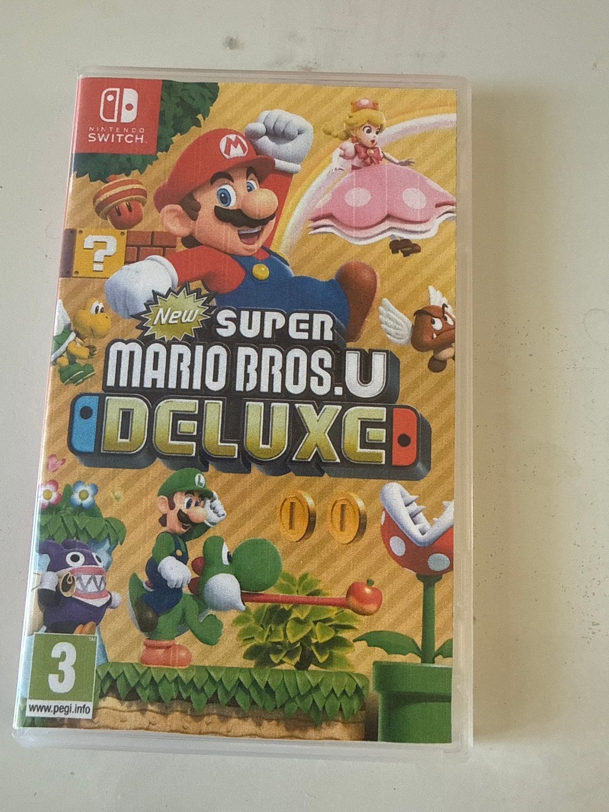 New Super Mario Bros. U Deluxe - Switch (doosje is kopie), Eén computer, Ophalen of Verzenden, Zo goed als nieuw, Platform