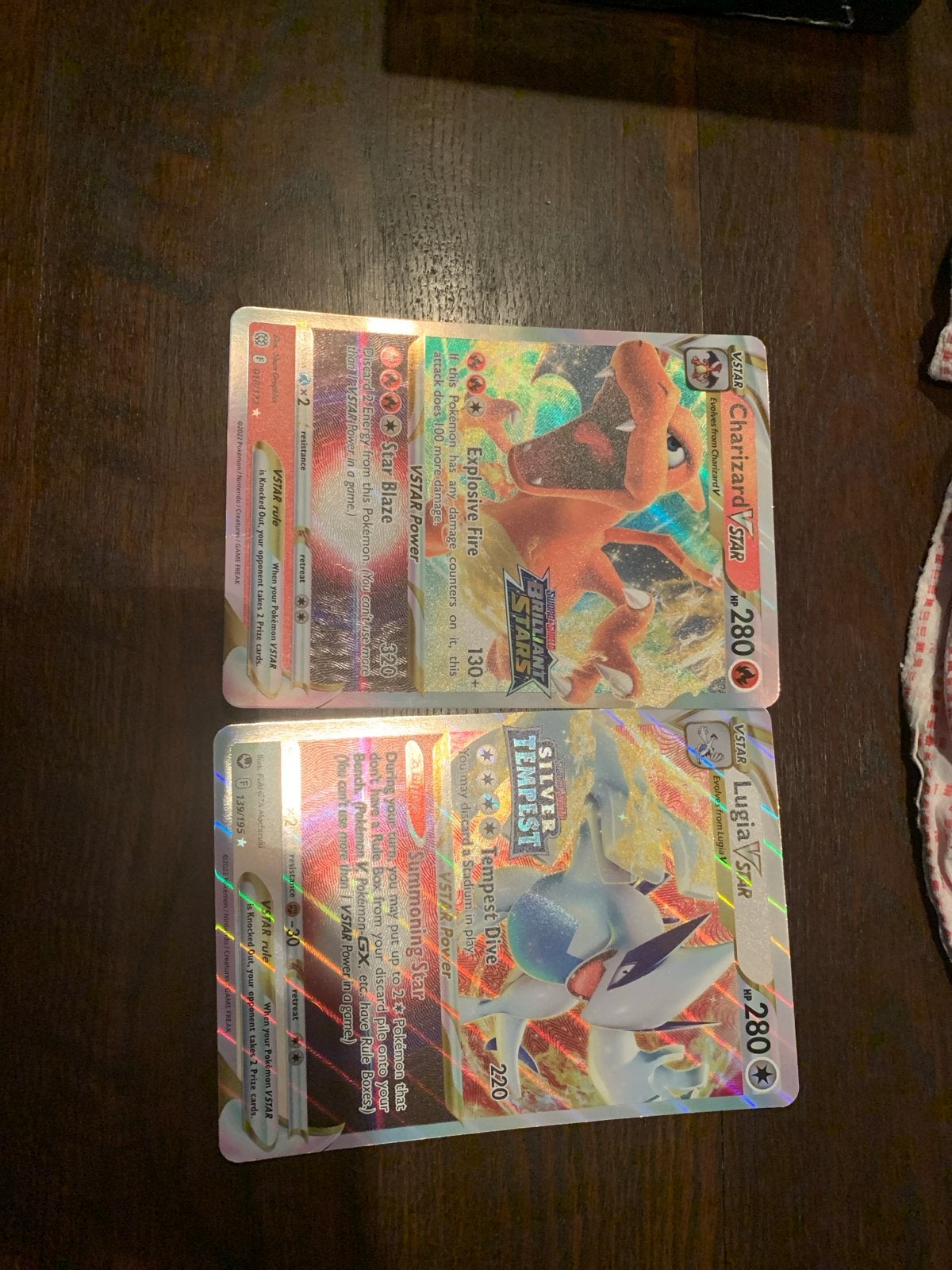 2 Jumbo Pokémon kaarten: Charizard VSTAR & Lugia VSTAR, Ophalen of Verzenden, Gebruikt, Meerdere kaarten, Foil