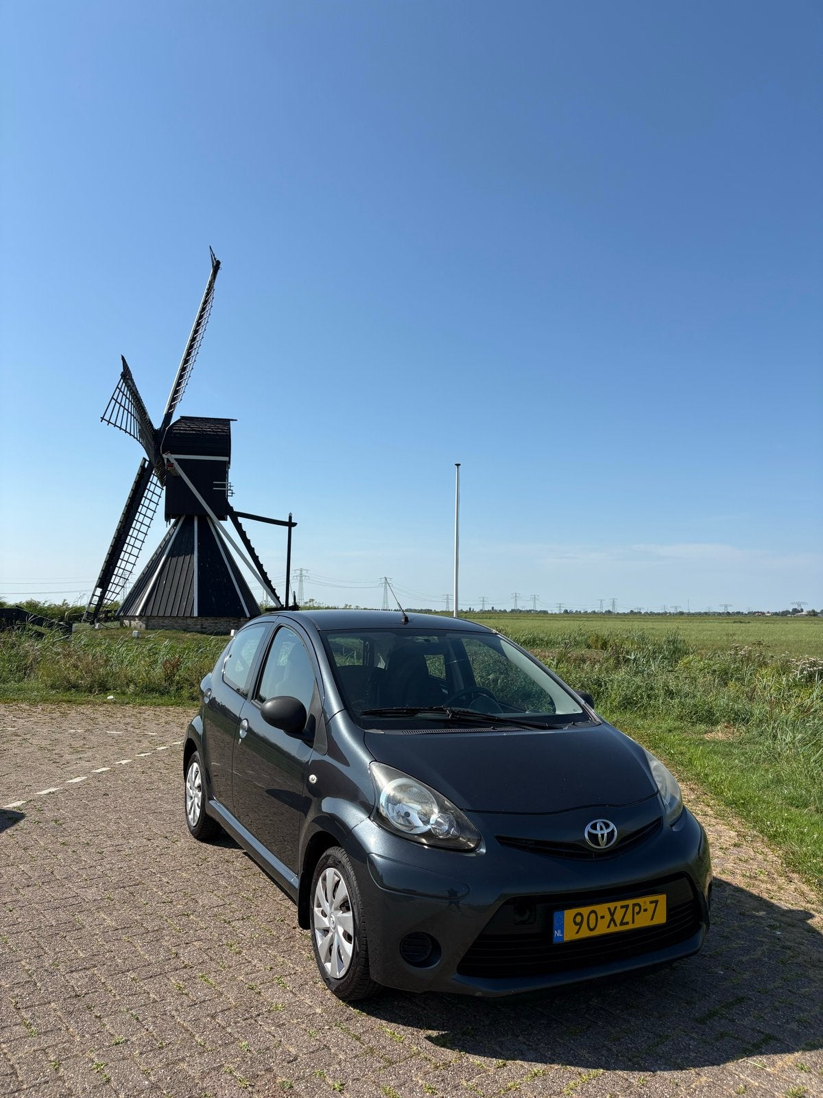Toyota Aygo 1.0 2012 Grijs, APK Juli 2027, 5DRS, Auto's, Voorwielaandrijving, 4 stoelen, Origineel Nederlands, Handgeschakeld