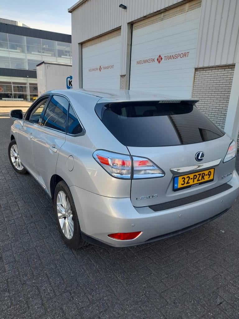 LEXUS RX450H Hybrid CVT 4WD 299pk YOUNGTIMER FULL OPTIONS, Auto's, Lexus, Automaat, 249 pk, Zwart, 2000 kg