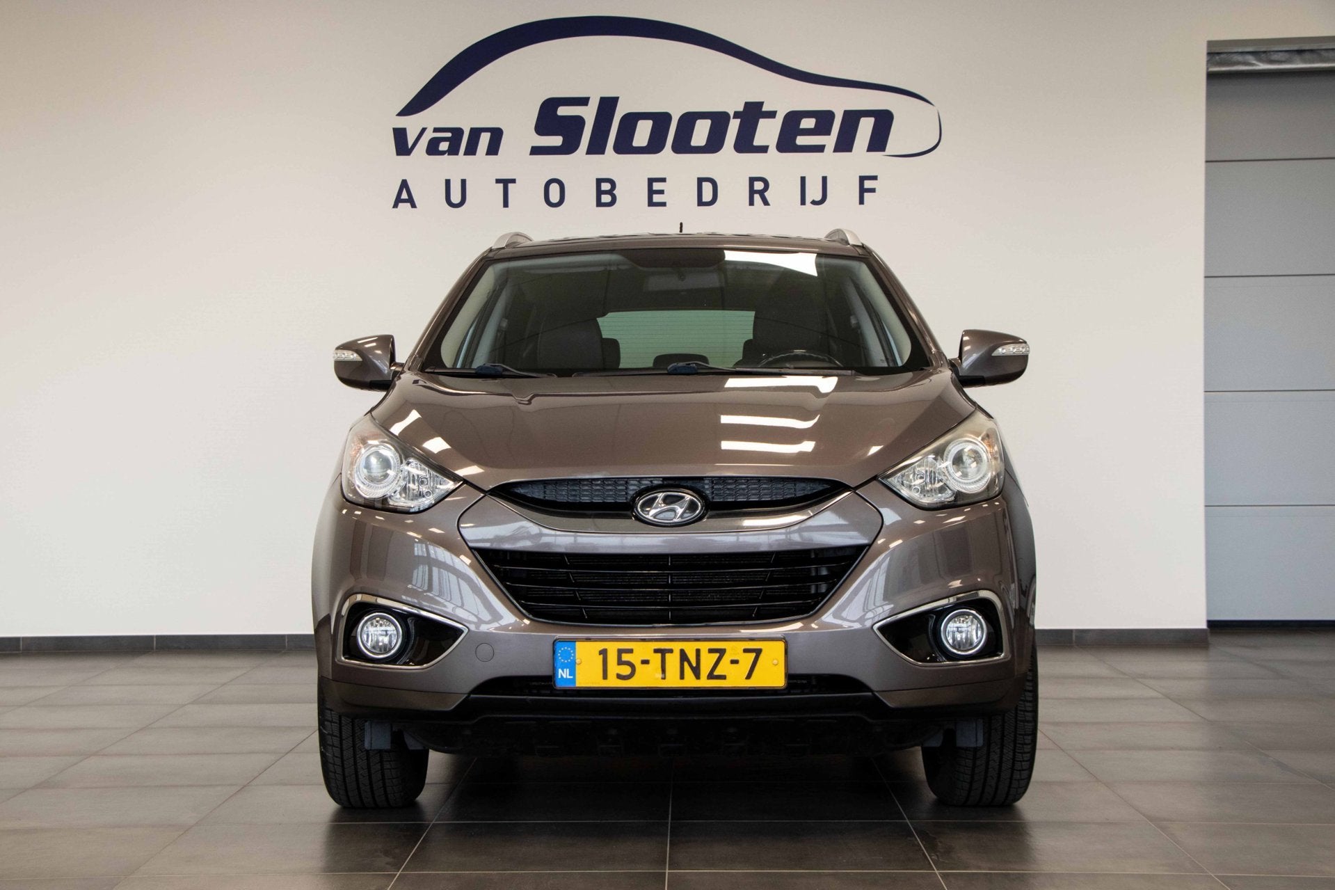 Hyundai Ix35 2.0i Business Edition | Automaat | Navigatie |, Auto's, Gebruikt, Zwart, 4 cilinders, Bruin