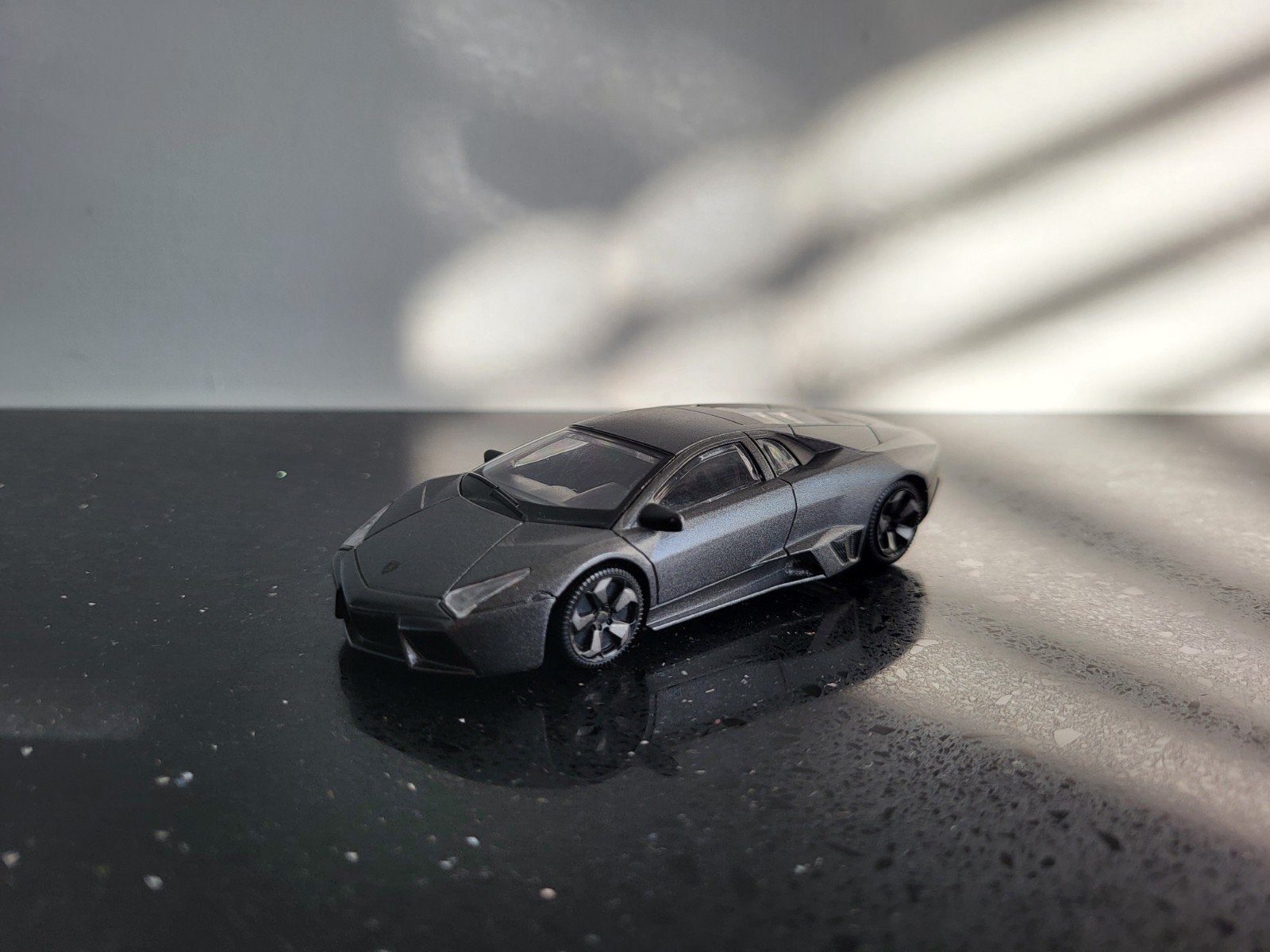 Lamborghini Reventon grijs 1/43 Rastar, Ophalen of Verzenden, Zo goed als nieuw, Auto, Overige merken