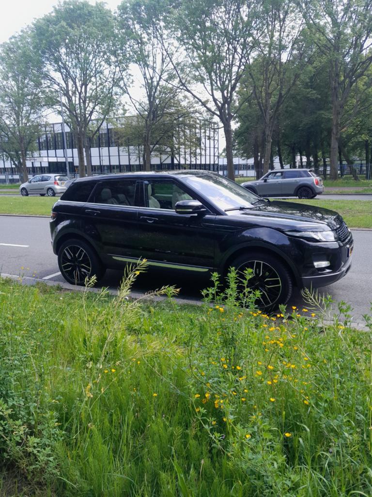 Land Rover Range Rover Evoque SI4 4WD AUT 2012 Zwart, Auto's, Automaat, 1800 kg, 4 cilinders, Zwart