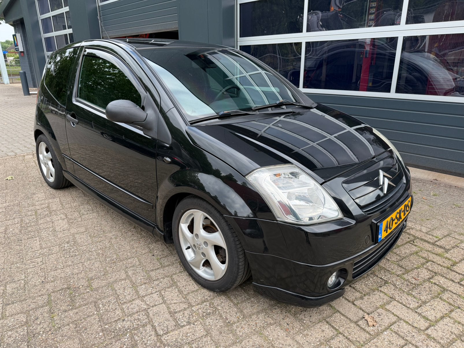 Citroën C2 1.6i 16V 2006 Zwart, Auto's, Citroën, Voorwielaandrijving, 450 kg, Zwart, 4 cilinders