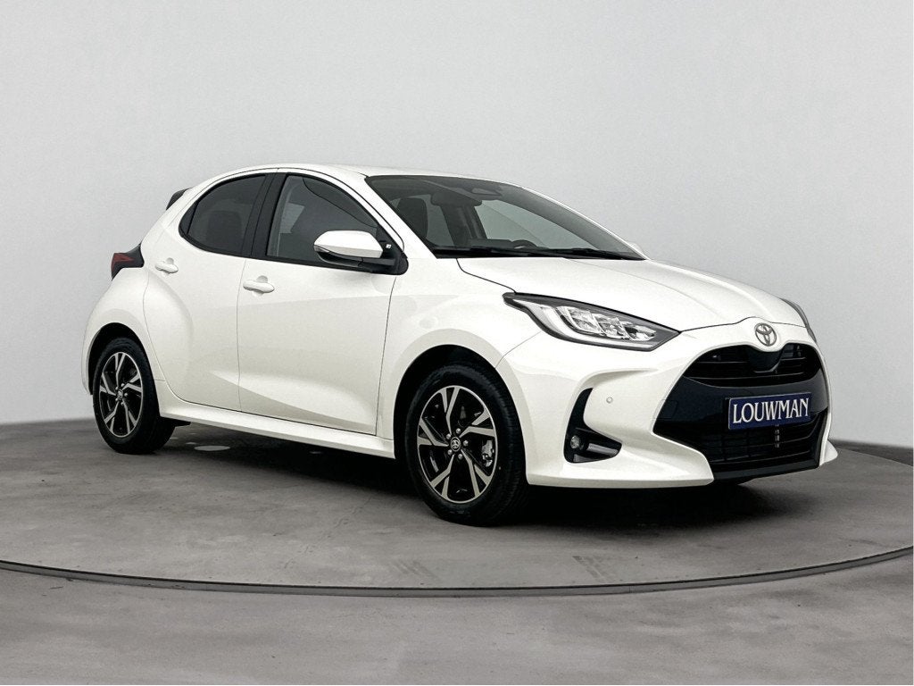 Toyota Yaris 1.5 Hybrid 115 Dynamic Comfort Pack Nu te BESTE, Auto's, 12 maanden, Stof, Zwart, 116 pk
