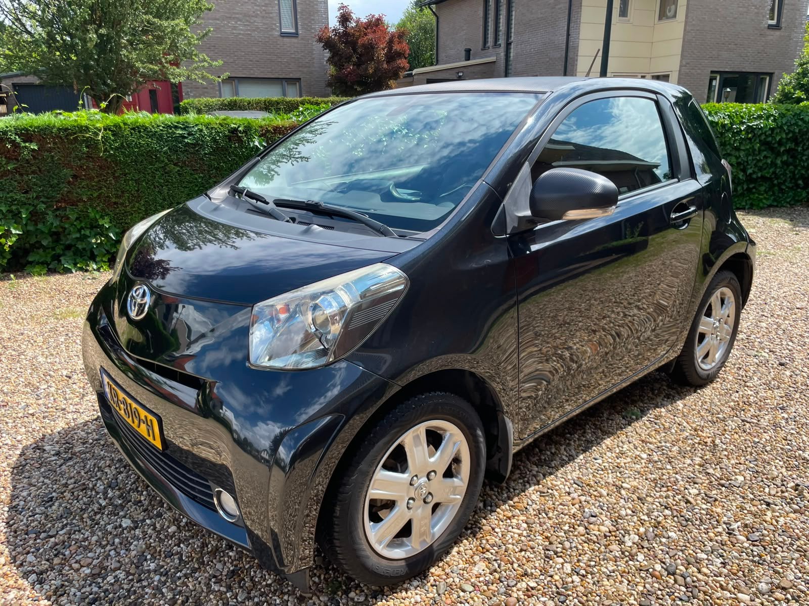 Toyota IQ 1.0 CVT 2009 Zwart automaat, Auto's, Zwart, 4 stoelen, Leder en Stof, Bedrijf