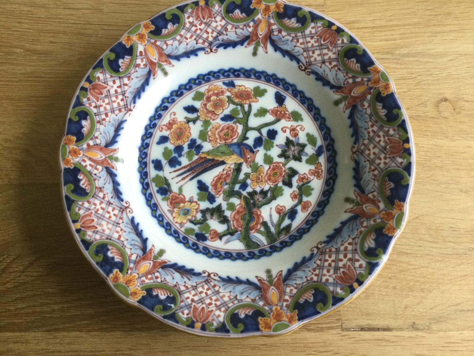 Makkum Tichelaar wandbord met vogel doorsnee 23,5 cm., Antiek en Kunst, Antiek | Wandborden en Tegels, Ophalen of Verzenden