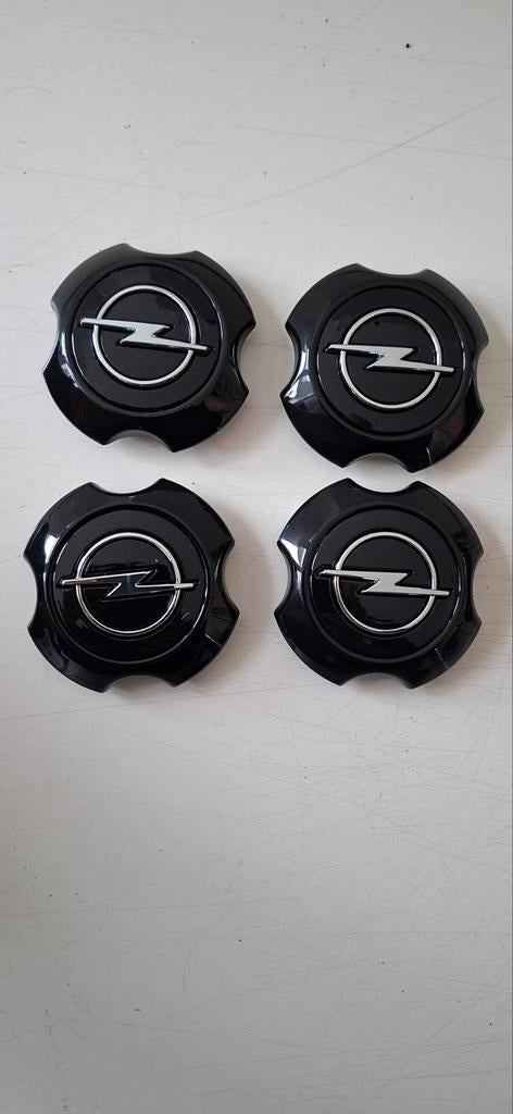 Set van 4 Opel wieldoppen / naafdoppen, zwart, Ophalen of Verzenden, Zo goed als nieuw