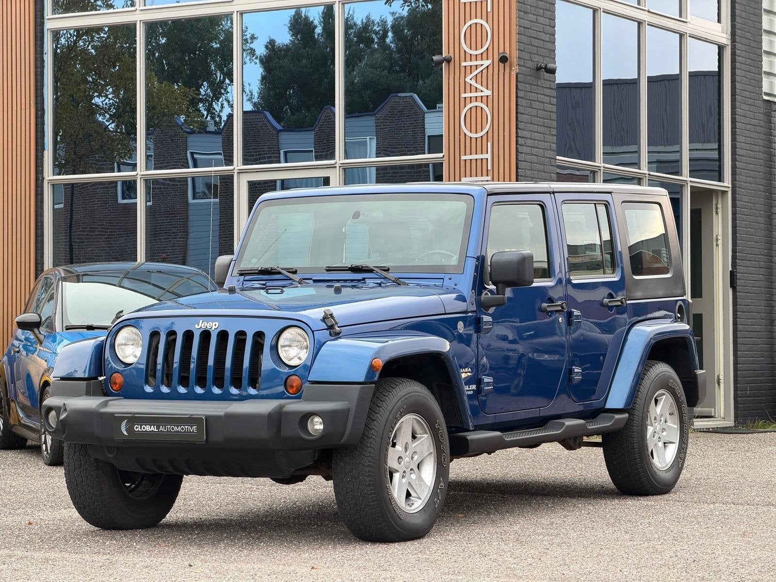 Jeep Wrangler Unlimited 3.8 Sahara - Afneembaar Dak - Centra, Stof, Gebruikt, Blauw, Bedrijf