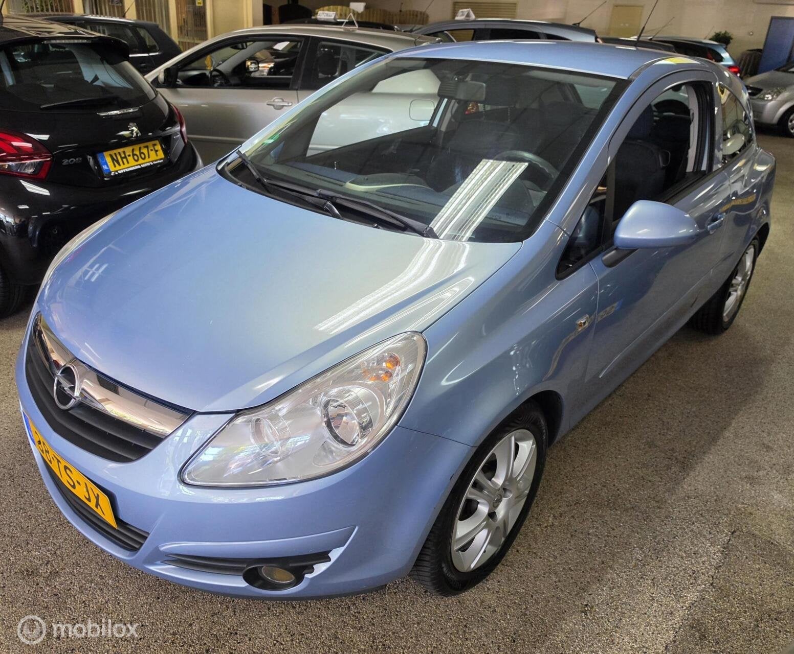 Opel Corsa 1.4-16V Cosmo AUTOMAAT, Auto's, 15 km/l, Gebruikt, 4 cilinders, Blauw