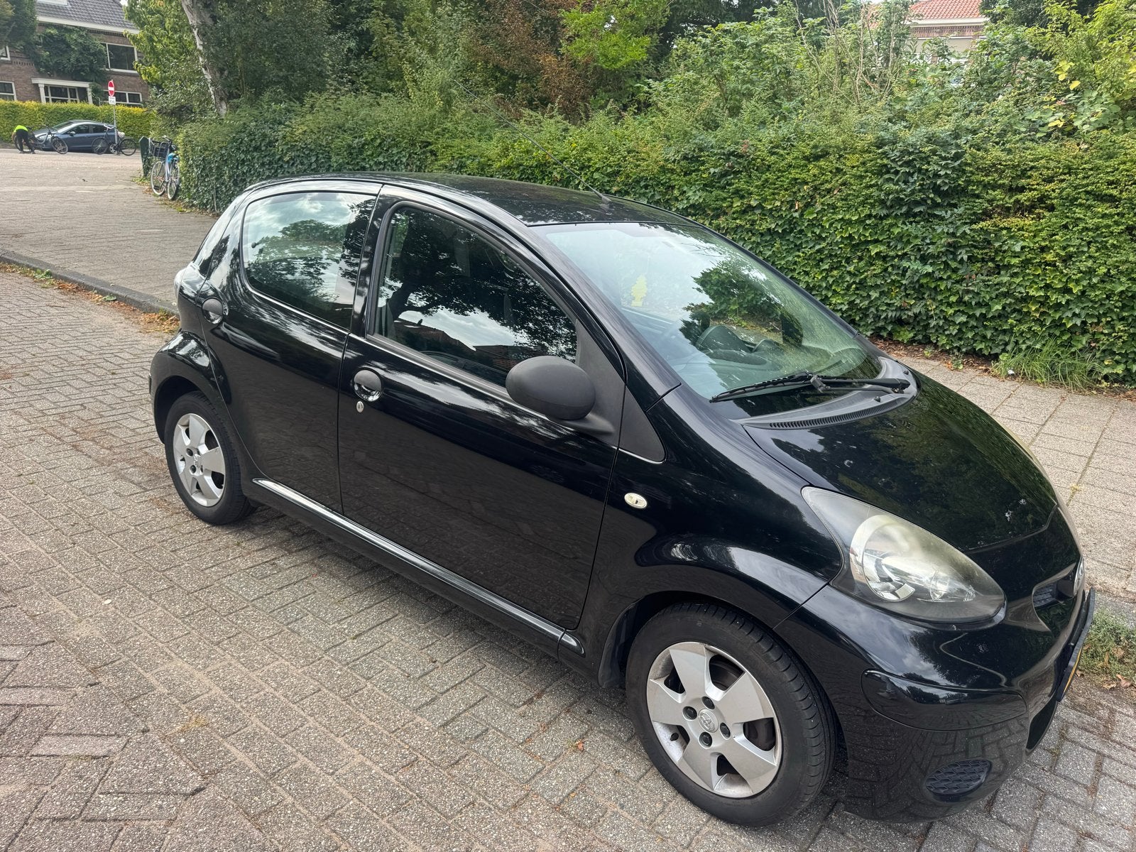 Toyota Aygo 1.0 12V Vvt-i 5DRS 2011 Zwart, Auto's, Voorwielaandrijving, 4 stoelen, Origineel Nederlands, Handgeschakeld