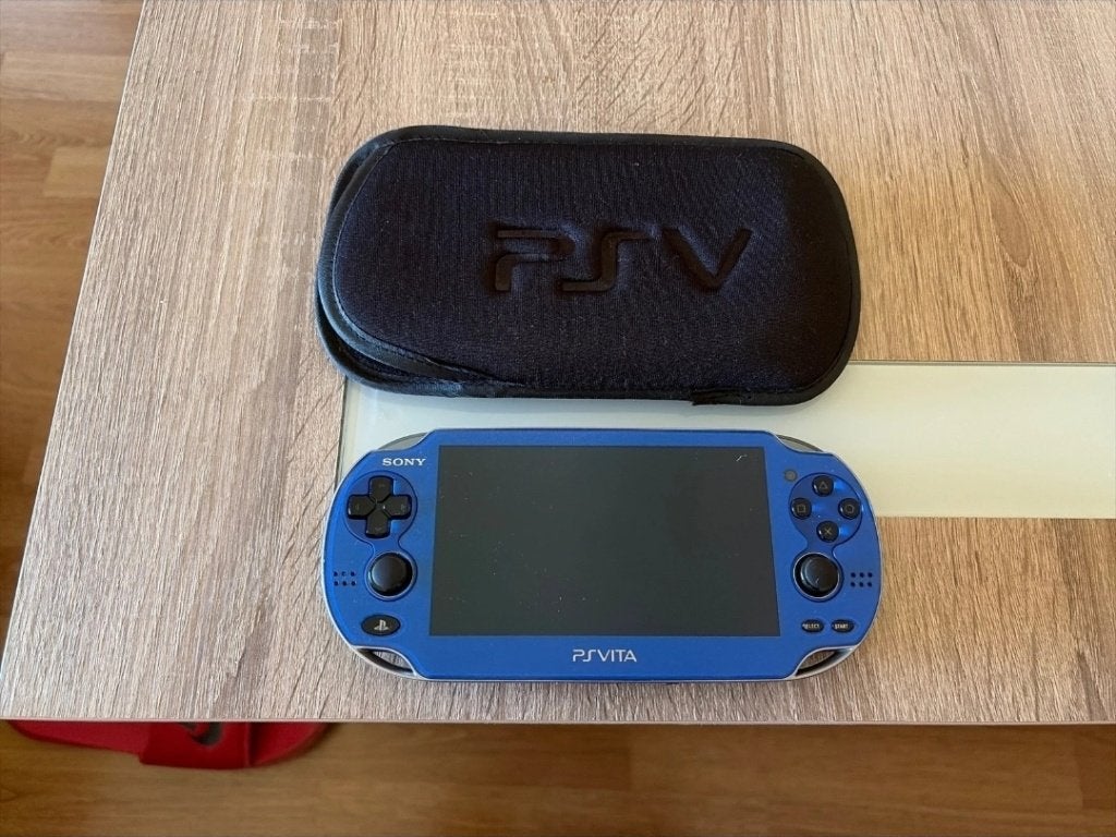 Sony PS Vita Blauw met hoesje - Zo goed als nieuw, Spelcomputers en Games, Ophalen of Verzenden, Zo goed als nieuw, Blauw