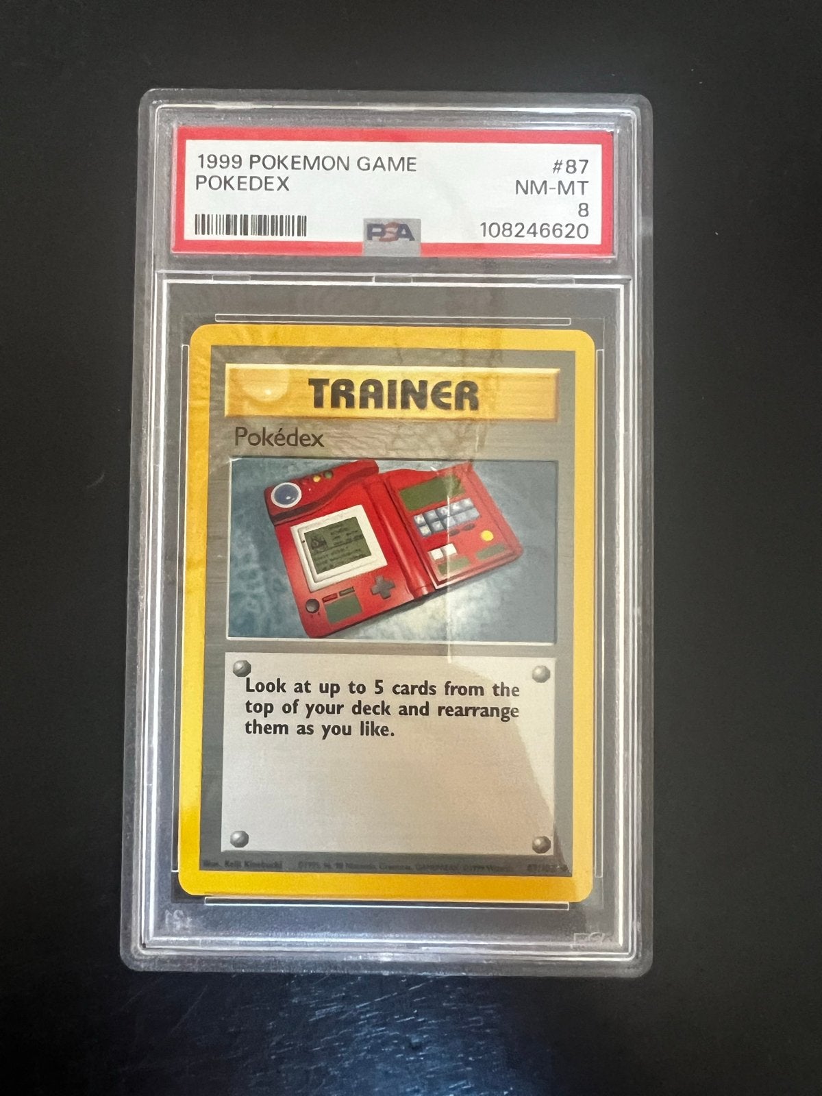 Pokémon Pokedex Trainer Kaart 1999 PSA 8 NM-MT, Ophalen of Verzenden, Zo goed als nieuw, Losse kaart