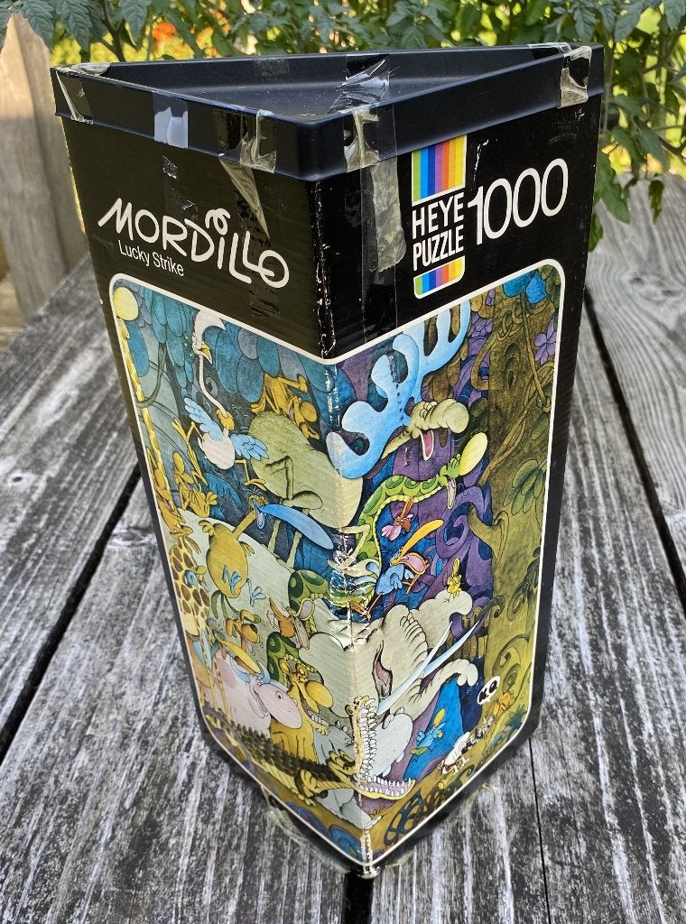 Leuke Guillermo Mordillo Puzzel - Lucky Strike vintage Heye, Ophalen of Verzenden, 500 t/m 1500 stukjes, Gebruikt, Legpuzzel