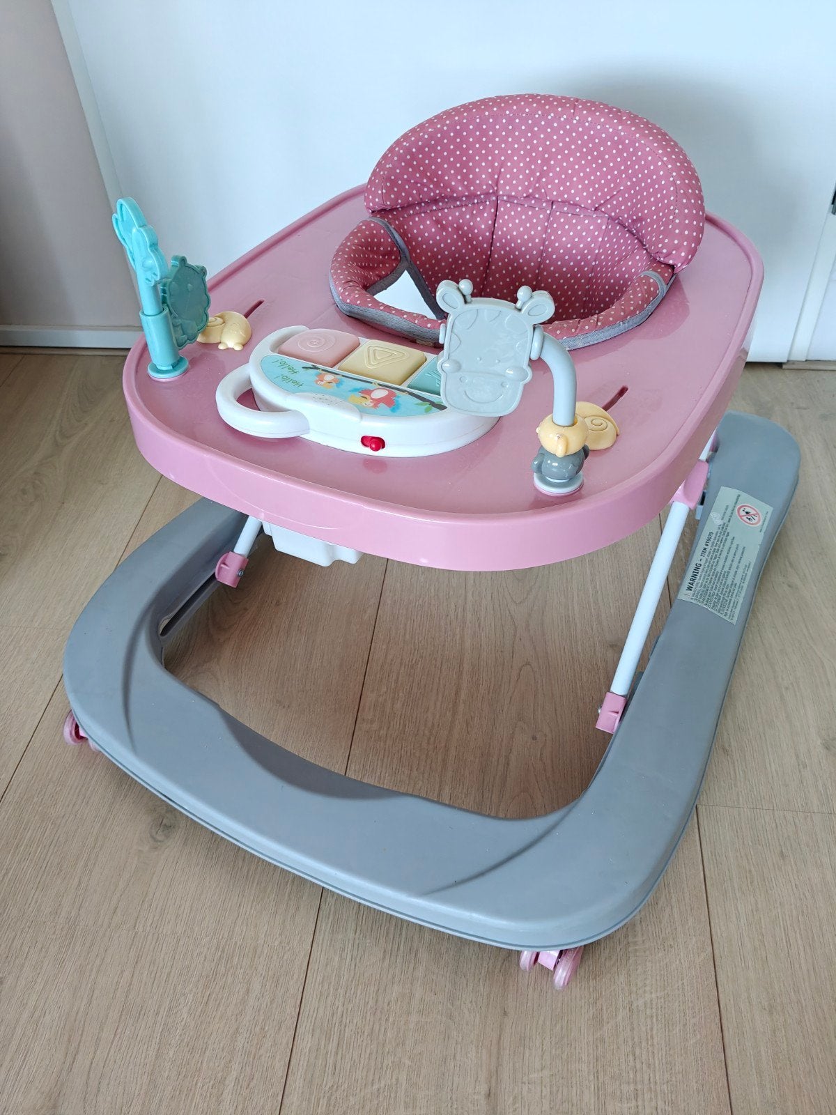 Roze baby loopstoel met speelblad, Ophalen