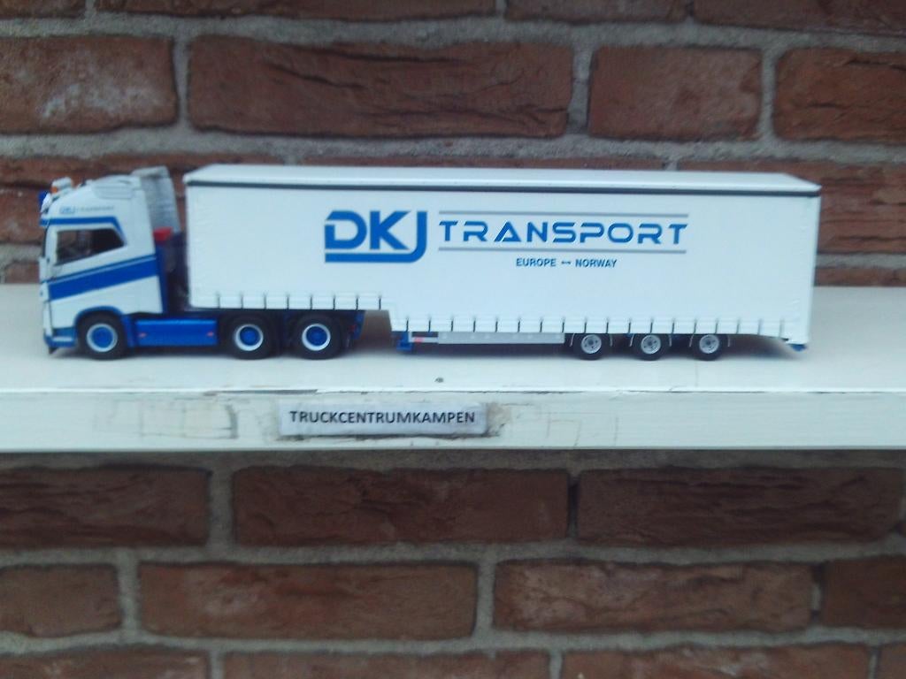 WSI  Volvo  FH4  Globetrotter  XL  van  D.K.J.  Transport., Ophalen of Verzenden, Nieuw, Bus of Vrachtwagen, Wsi