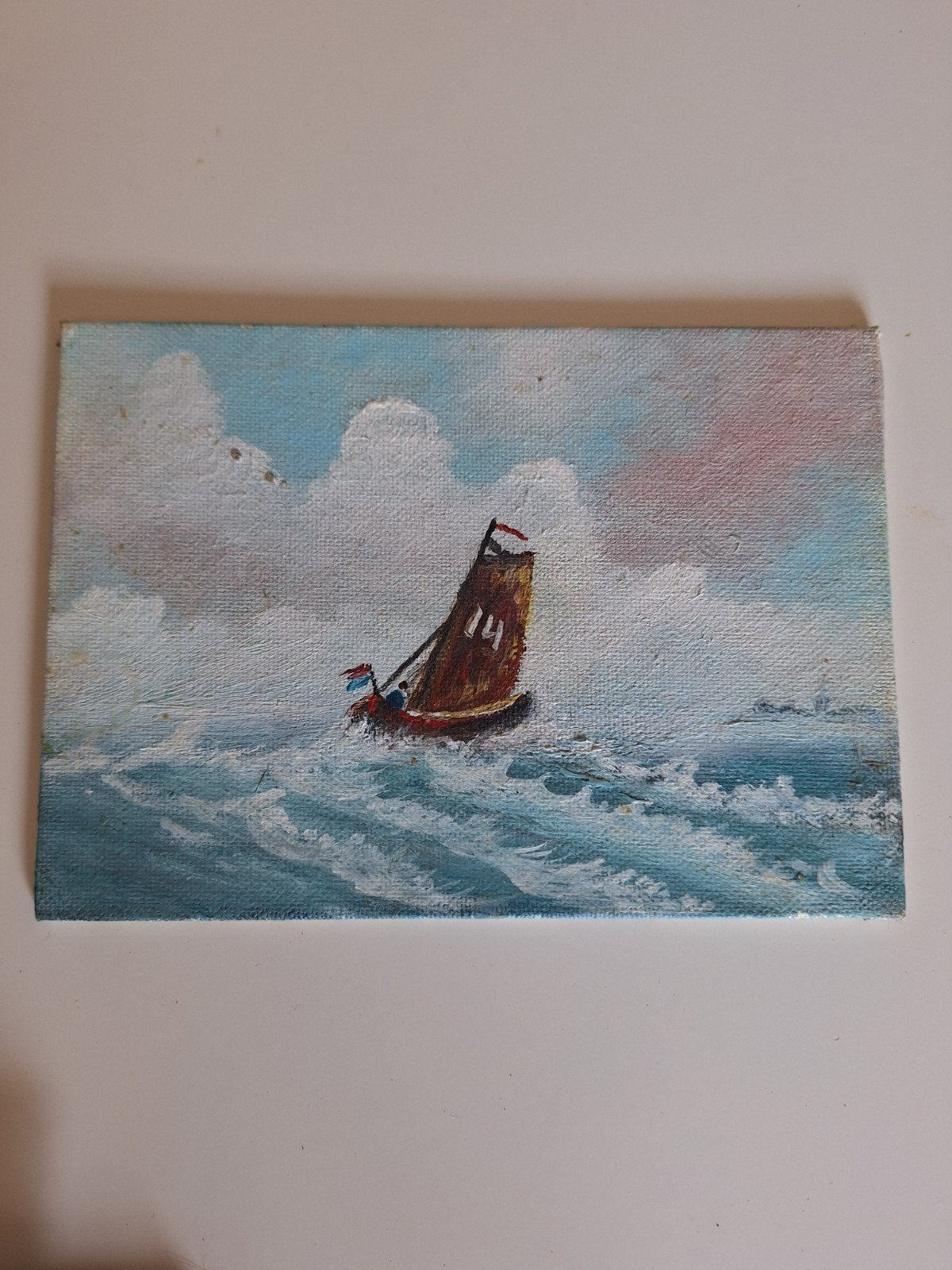 Schilderij van een zeilboot op woelige zee, Ophalen