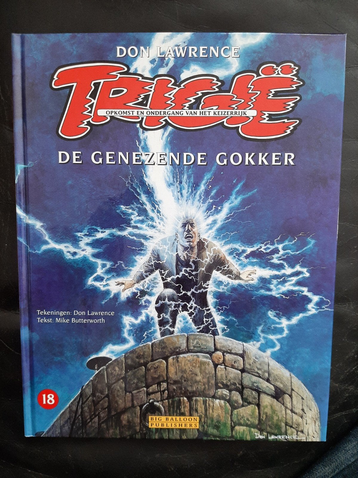 Trigie: De Genezende Gokker - Nummer 18 (1998), Eén stripboek, Ophalen of Verzenden, Gelezen, Don Lawrence, Mike Butterworth