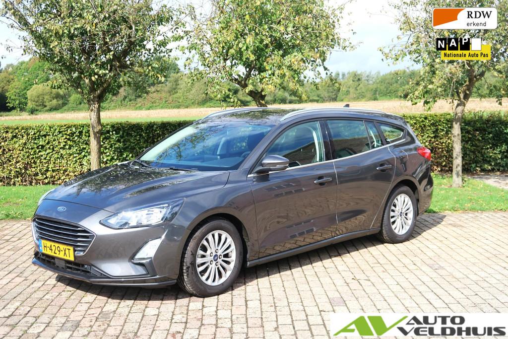 Ford Focus Wagon 1.0 EcoBoost Titanium Business, Gebruikt, Lichtsensor, Met garantie (alle), Origineel Nederlands