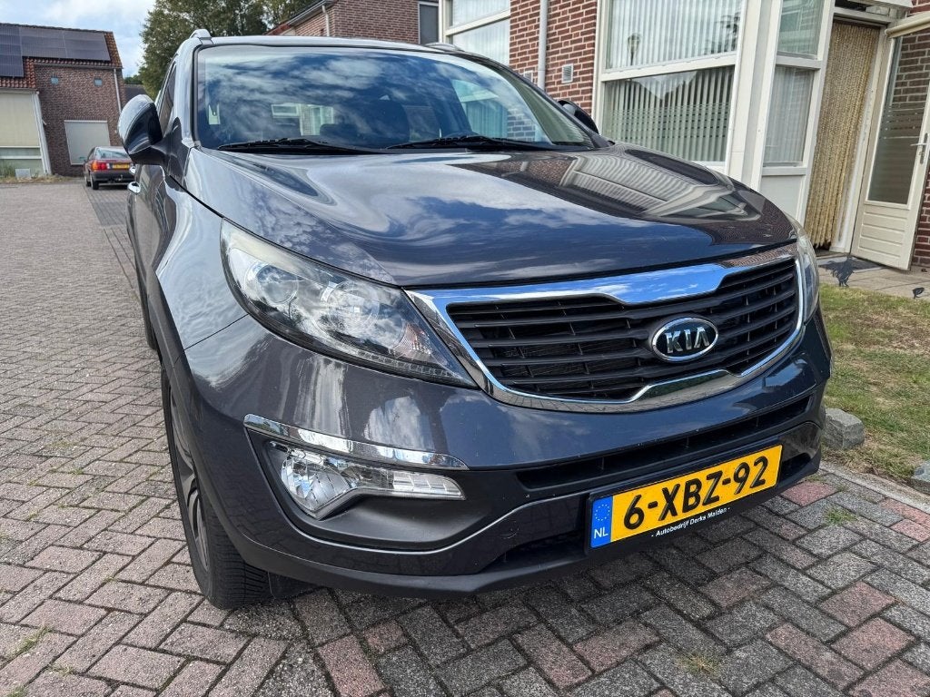 Kia Sportage 2.0 Cvvt 2WD AUT 2010 Grijs, Auto's, Kia, 1998 cc, Stof, Zwart, 4 cilinders