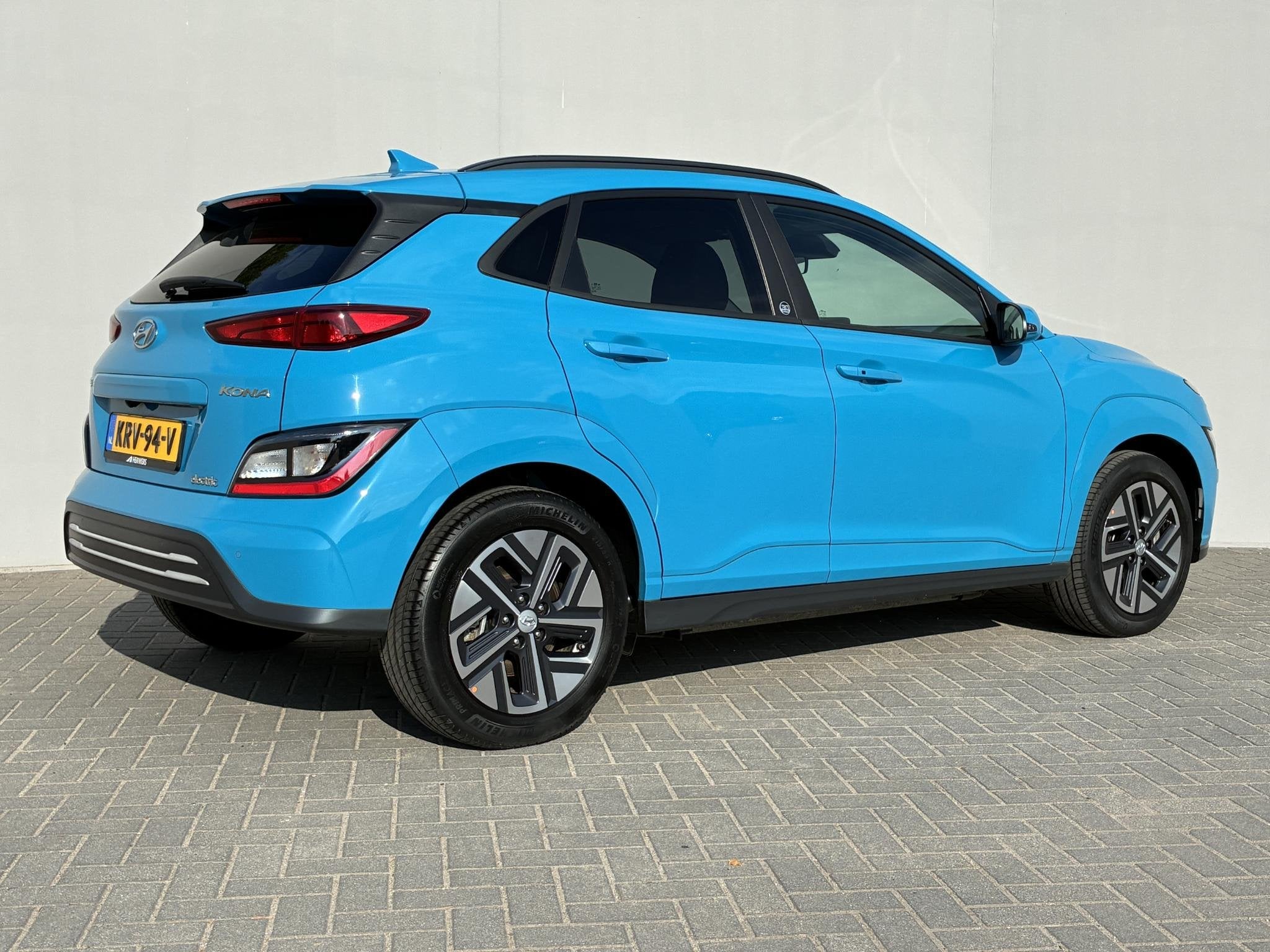 Hyundai Kona EV Fashion Design 39 kWh / SOH 97% / Fabrieksga, Auto's, 136 pk, Gebruikt, Blauw, Leder en Stof