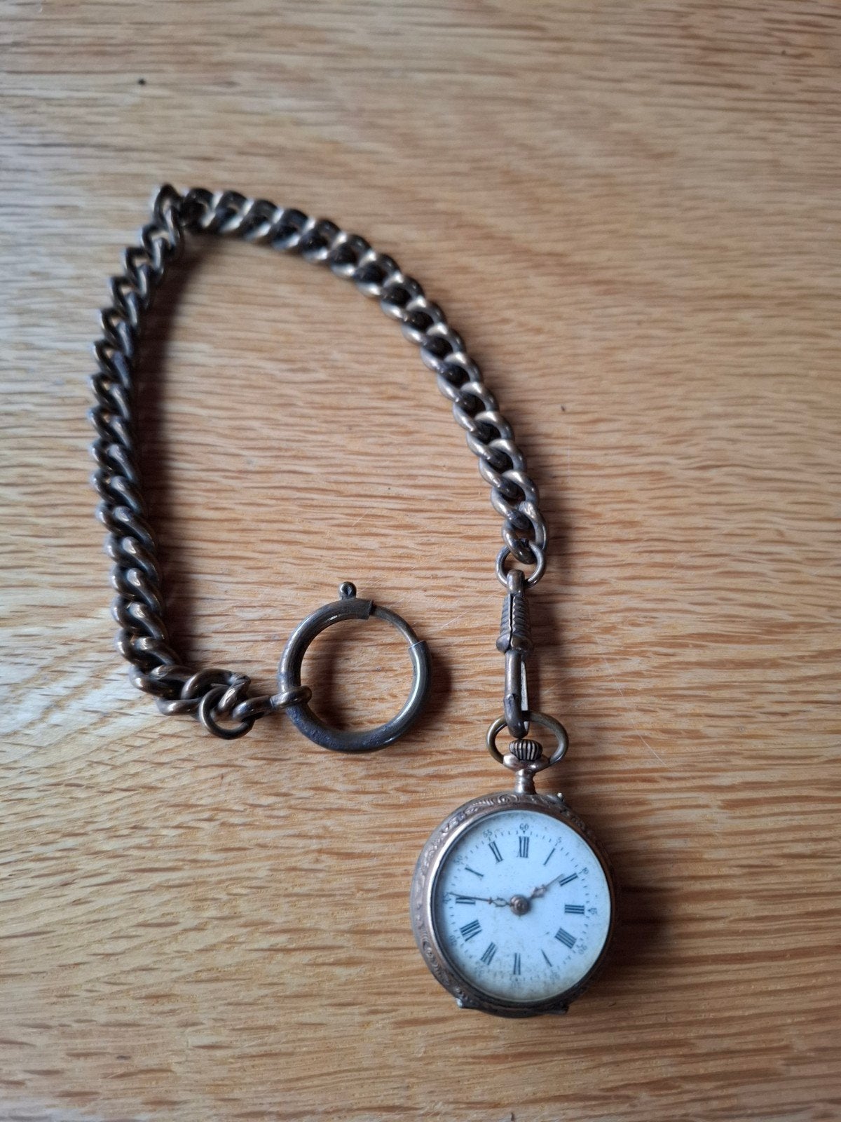 Antiek zakhorloge met ketting, Ophalen