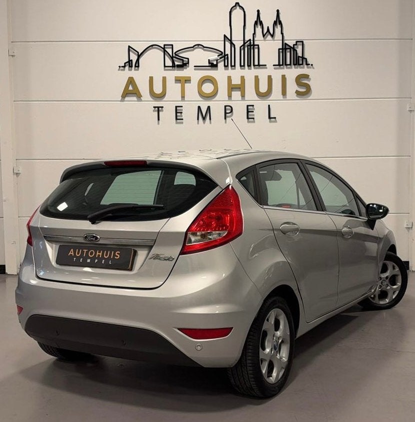 Ford Fiesta 1.25 Titanium Nap Airco Cruise Climate Parkeerse, Auto's, Voorwielaandrijving, Stof, 1242 cc, 82 pk