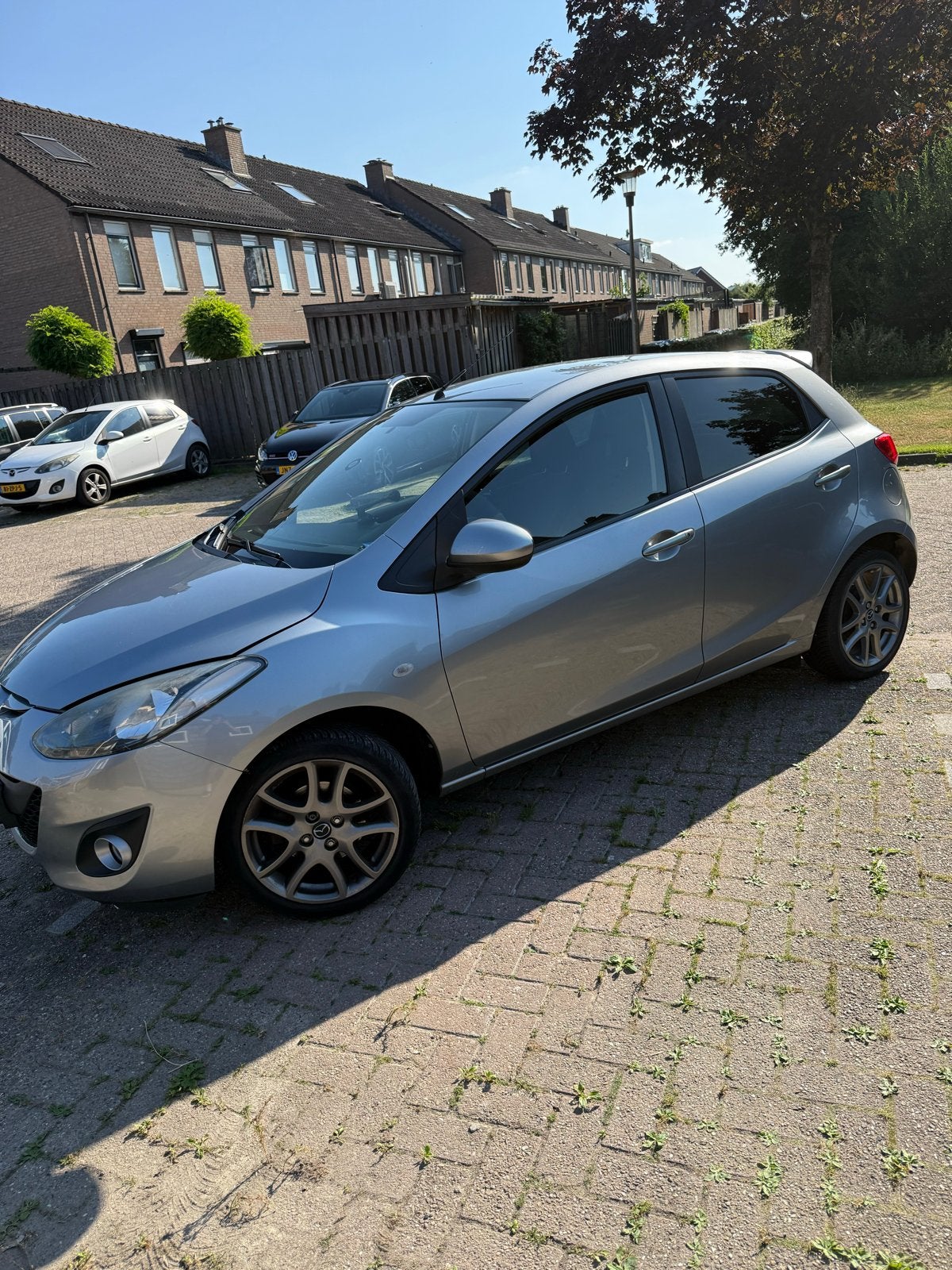 Mazda 2 1.3 Bifuel 62KW 5DRS 2012 Grijs, Auto's, Mazda, Voorwielaandrijving, 15 km/l, 37 €/maand, 4 cilinders