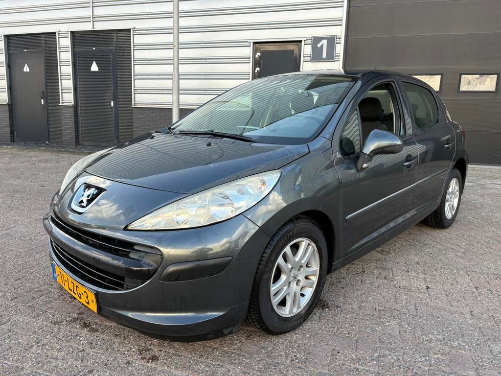 Peugeot 207 1.4 VTI 16V 5DRS 2010 Grijs, Auto's, Voorwielaandrijving, Stof, Origineel Nederlands, Bedrijf