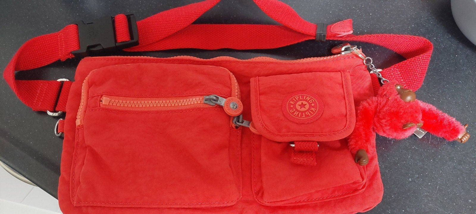 Kipling heuptasje rood als nieuw, 30 cm of meer, Minder dan 35 cm, Ophalen of Verzenden, Zo goed als nieuw