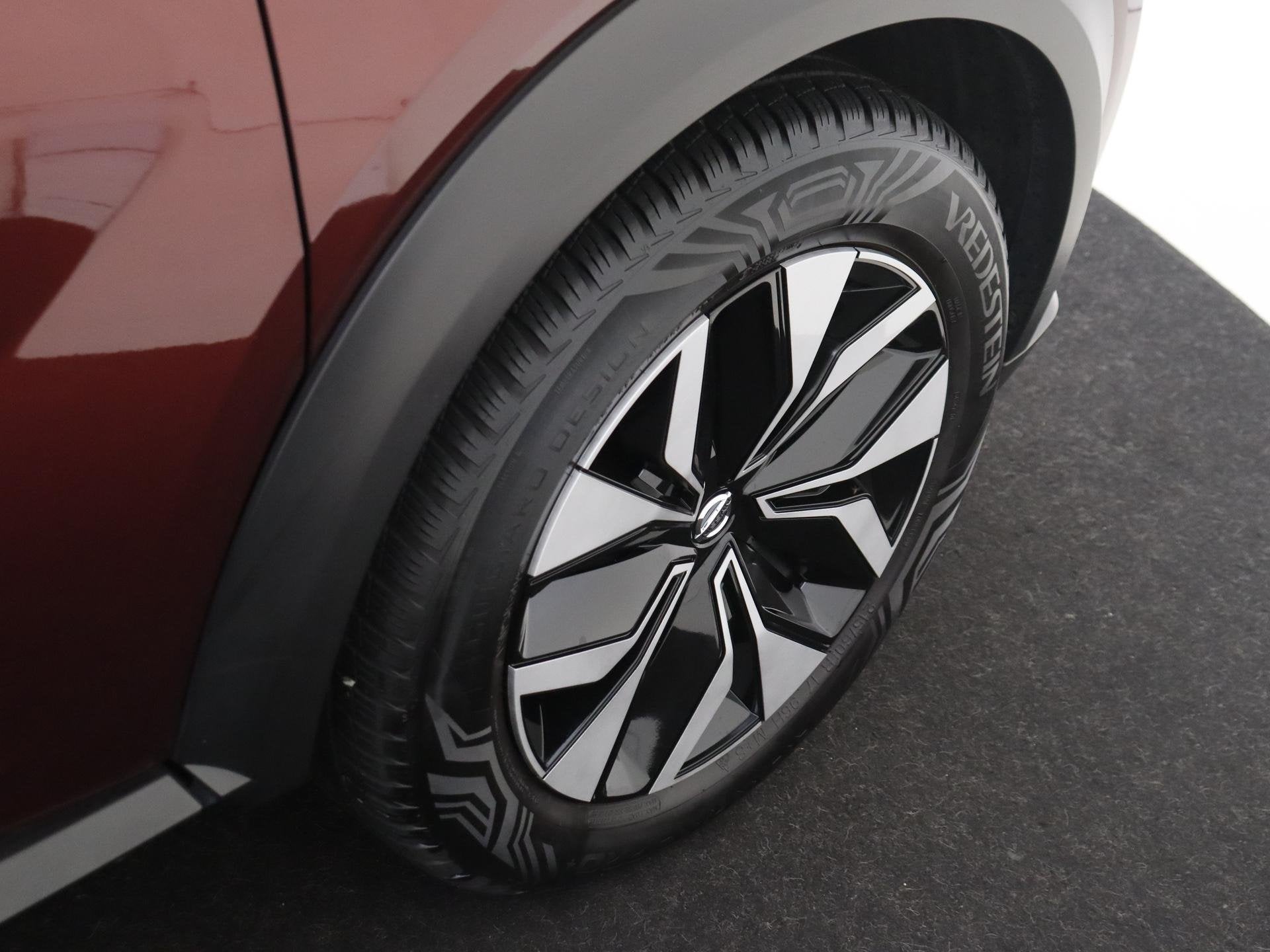 Foto 11 van Nissan Juke 1.0 DIG-T Acenta | Achteruitrijcamera | Wieldopp
