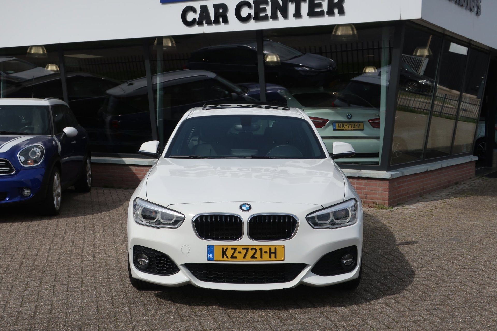 BMW 1-serie 118i Centennial High Executive DealerOH_LED_1eEi, Auto's, BMW, Gebruikt, Wit, Bedrijf, 650 kg