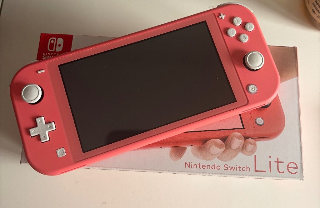 Nintendo Switch Lite, Spelcomputers en Games, Spelcomputers | Nintendo Switch Lite, Ophalen of Verzenden, Roze of Coral, Zo goed als nieuw