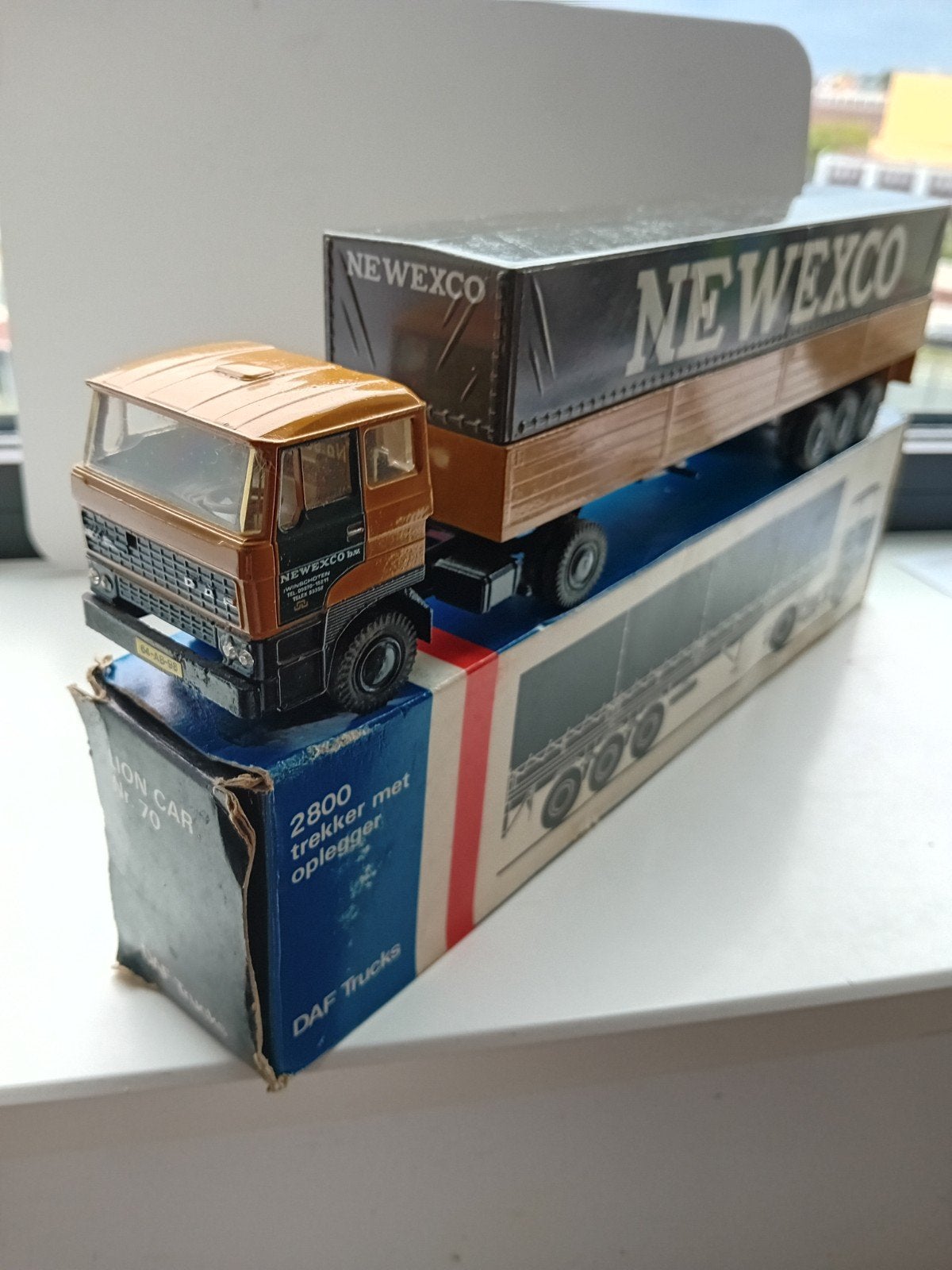 Daf 2800 trekker met oplegger Newexco., Hobby en Vrije tijd, Modelauto's | 1:50, Ophalen of Verzenden, Bus of Vrachtwagen, Lion Toys